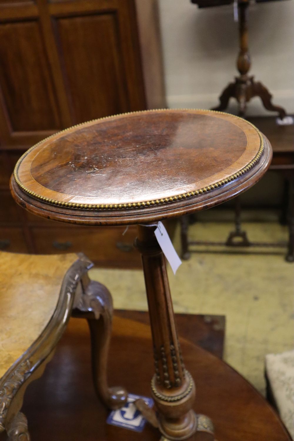 A brass mounted walnut tripod wine table and a Queen Anne style walnut low table, tripod table diameter 34cm height 75cm